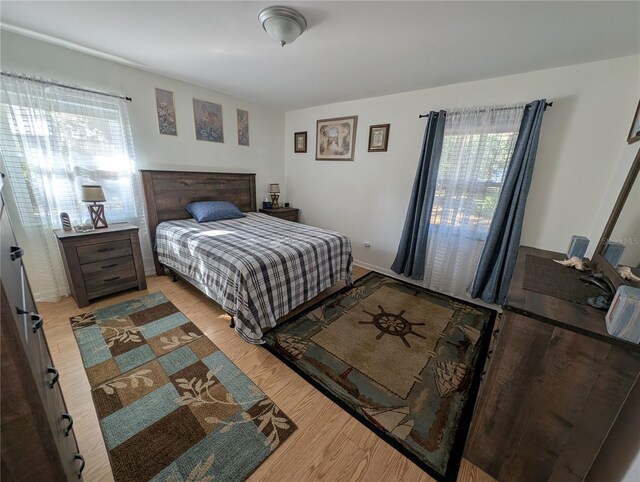 bedroom featuring wood finished floors