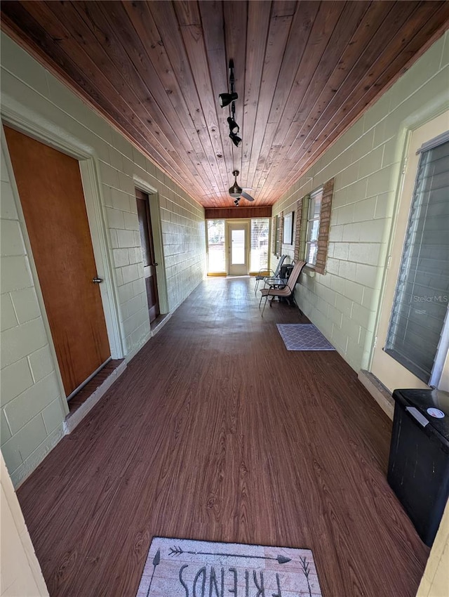 wooden terrace featuring a porch and a ceiling fan