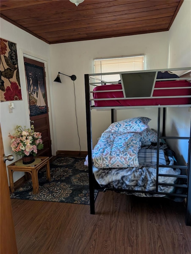 bedroom featuring wooden ceiling and wood finished floors