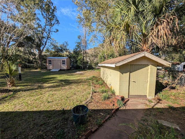 view of yard with an outbuilding and a storage unit