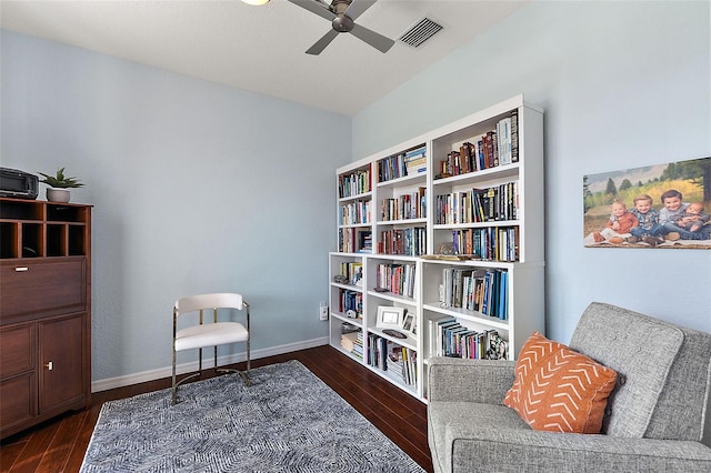 living area with visible vents, baseboards, ceiling fan, and wood finished floors