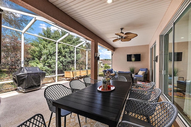 view of patio / terrace with a lanai, a grill, outdoor lounge area, and ceiling fan