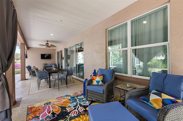 view of patio / terrace featuring outdoor dining space, an outdoor hangout area, and ceiling fan