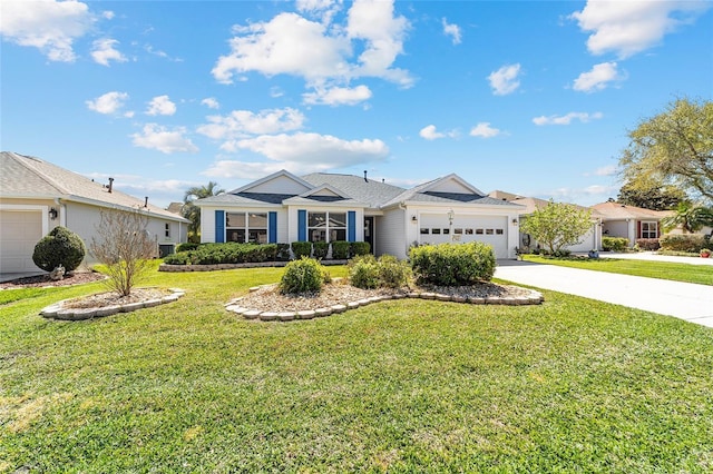 view of front of home with driveway, an attached garage, and a front lawn