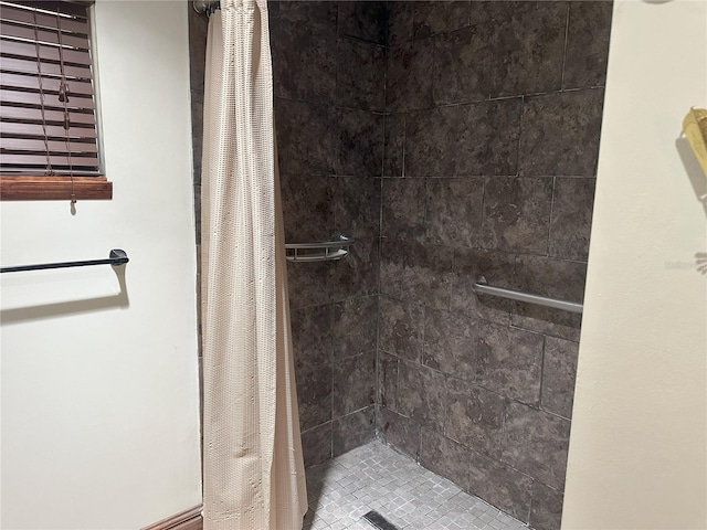 bathroom with a shower stall