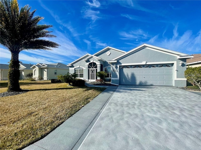 ranch-style home with a front lawn, an attached garage, concrete driveway, and stucco siding