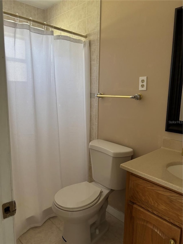 full bath with a shower with curtain, vanity, toilet, and tile patterned floors