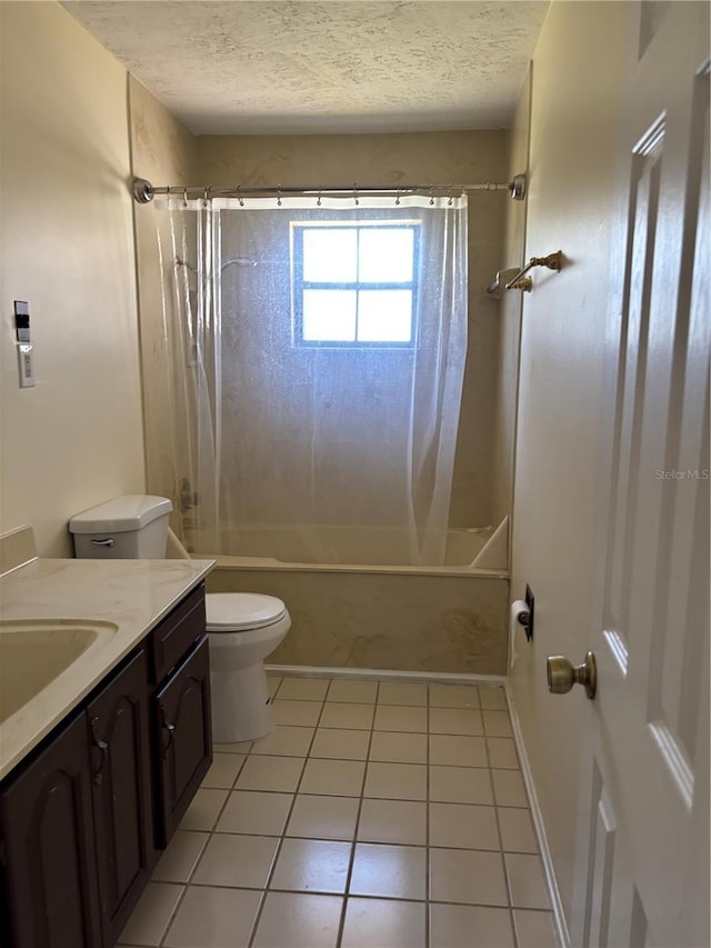 full bathroom featuring a textured ceiling, vanity, tile patterned flooring, and toilet