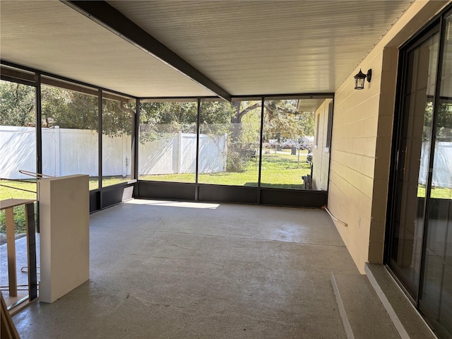 unfurnished sunroom featuring a wealth of natural light