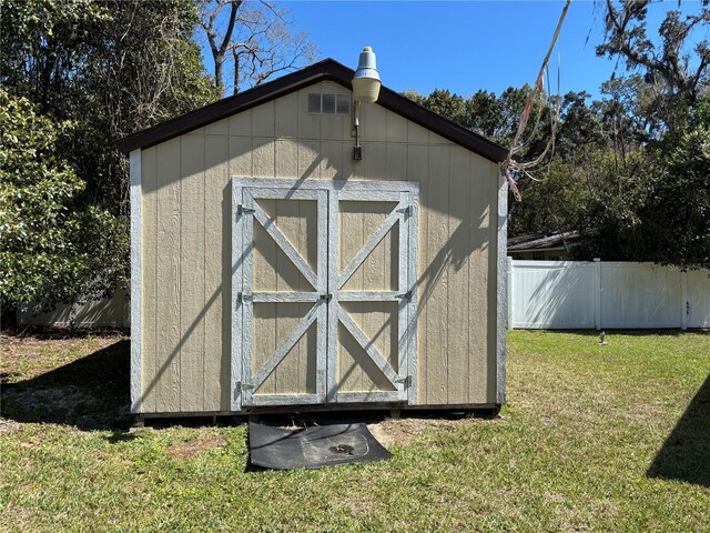 view of shed with fence