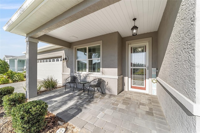 view of patio featuring an attached garage