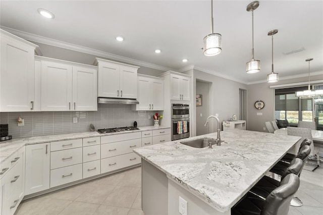 kitchen featuring ornamental molding, stainless steel appliances, under cabinet range hood, and a sink