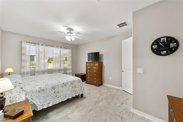 bedroom with a ceiling fan, baseboards, visible vents, and marble finish floor