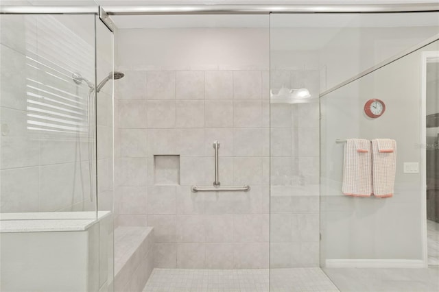 full bath featuring a tile shower