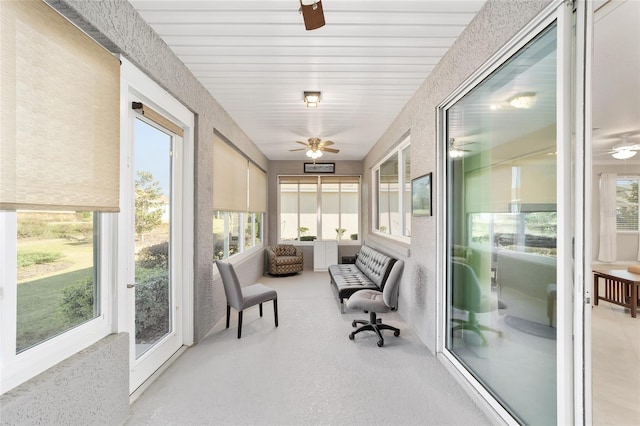 sunroom featuring ceiling fan