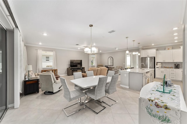dining area featuring recessed lighting, an inviting chandelier, visible vents, light tile patterned flooring, and crown molding