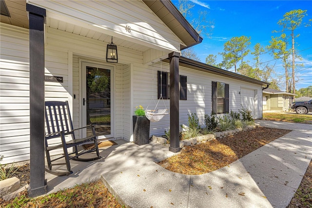 view of exterior entry with an attached garage