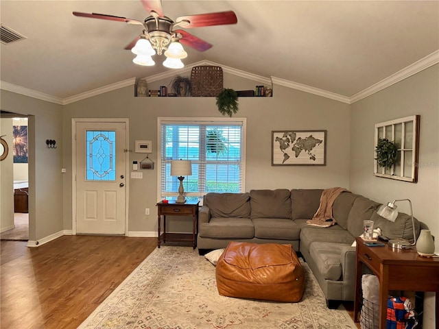 living room featuring ornamental molding, dark wood-style flooring, visible vents, and vaulted ceiling