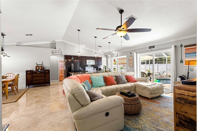 living room with visible vents, ornamental molding, ceiling fan, and vaulted ceiling