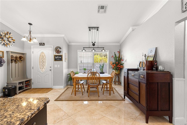 dining area with crown molding, light tile patterned flooring, and visible vents