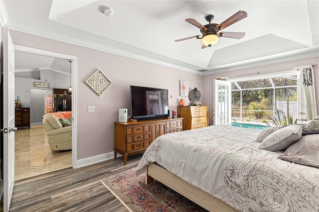 bedroom with vaulted ceiling, stainless steel fridge with ice dispenser, and ornamental molding