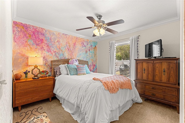 carpeted bedroom featuring ceiling fan and ornamental molding