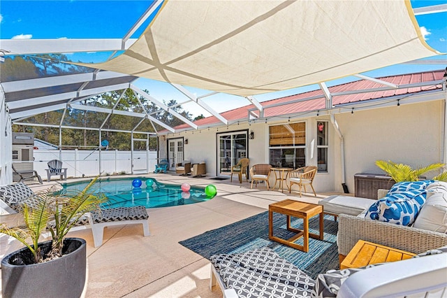 view of swimming pool with a fenced in pool, an outdoor living space, fence, a lanai, and a patio