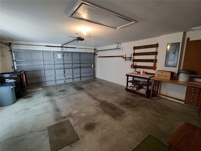 garage featuring electric panel and a garage door opener