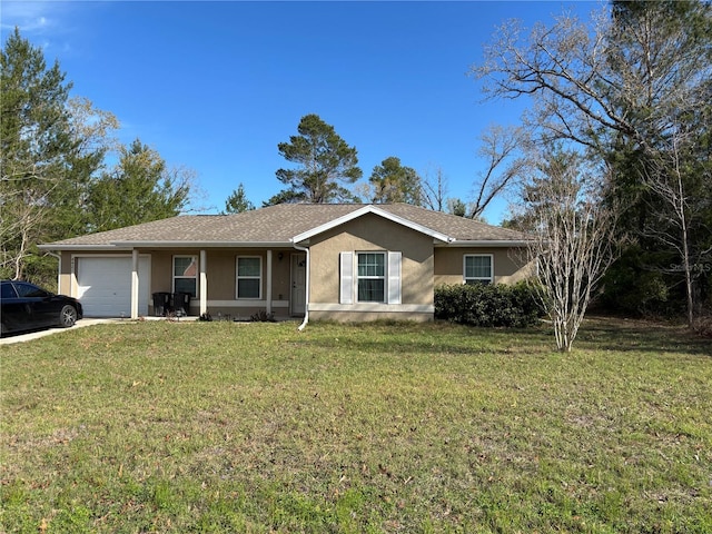 ranch-style house with stucco siding, a front yard, and an attached garage