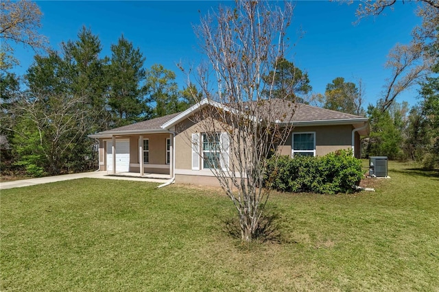 back of house with cooling unit, a yard, stucco siding, concrete driveway, and a garage