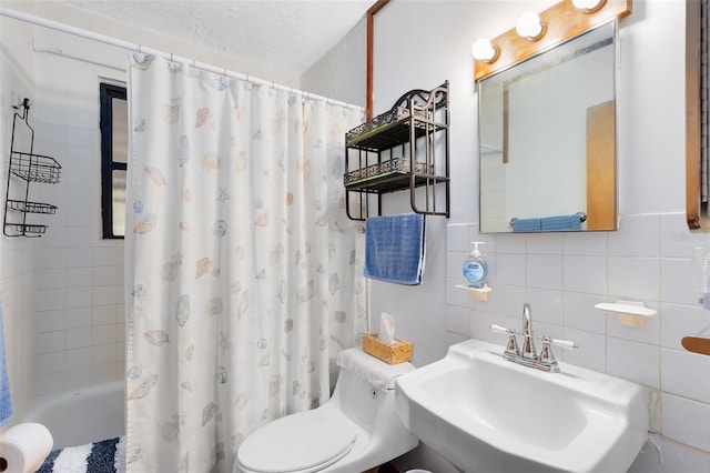 bathroom with tile walls, shower / bathtub combination with curtain, backsplash, toilet, and a sink