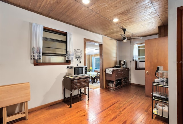 corridor with wood ceiling, baseboards, and wood-type flooring