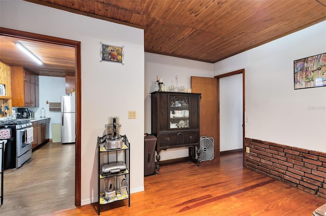 hallway featuring wooden ceiling and wood finished floors