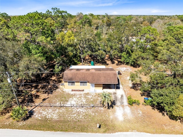 aerial view with a wooded view