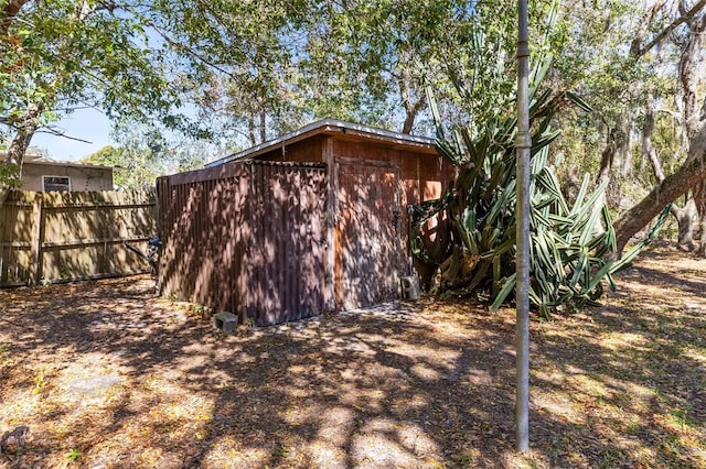 view of outdoor structure with an outdoor structure and fence