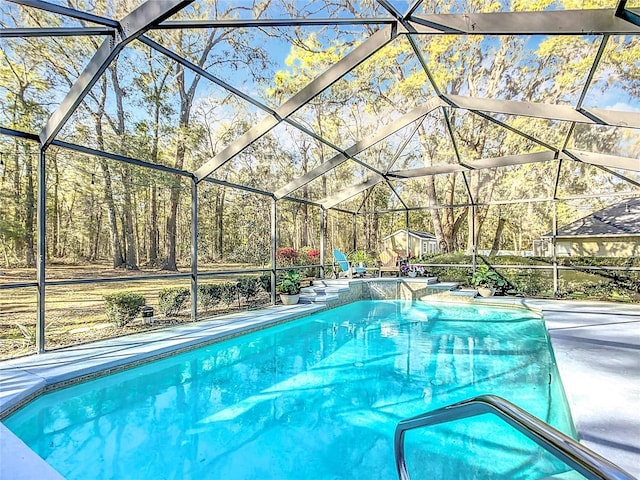 outdoor pool with glass enclosure and a patio area