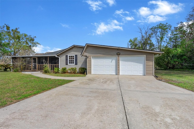 single story home featuring a front lawn, concrete driveway, covered porch, and an attached garage