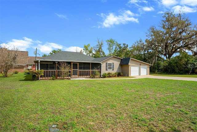 single story home featuring concrete driveway, a front yard, a garage, and a sunroom