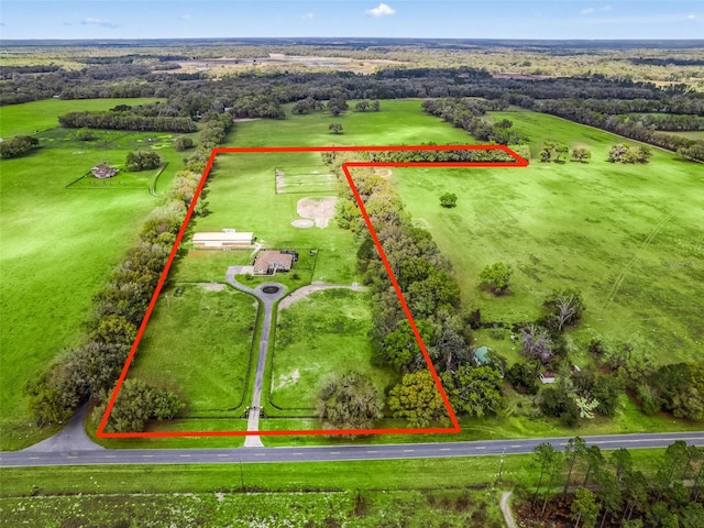 birds eye view of property featuring a rural view