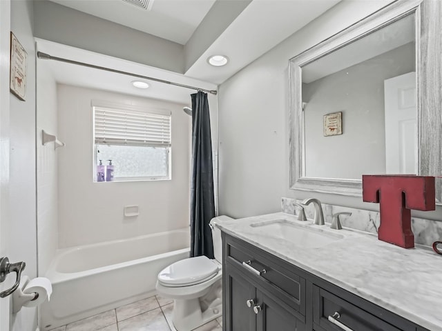 bathroom with vanity, tile patterned floors, toilet, and shower / tub combo with curtain