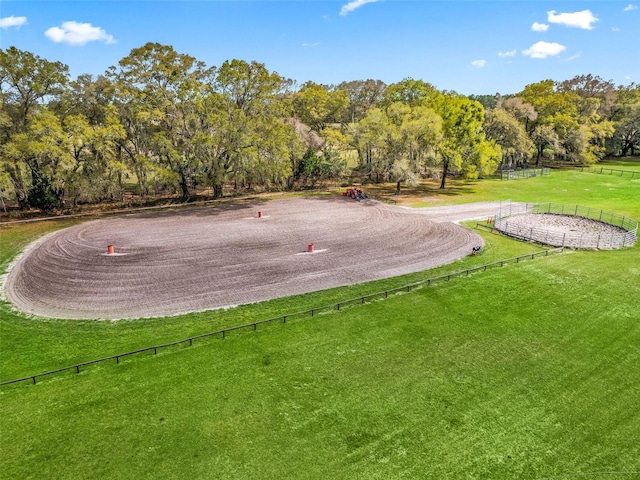 surrounding community with a yard and fence