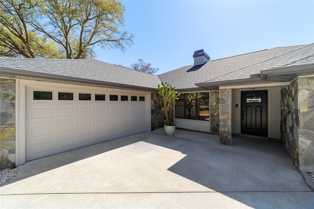 exterior space featuring a garage, stone siding, roof with shingles, and a chimney