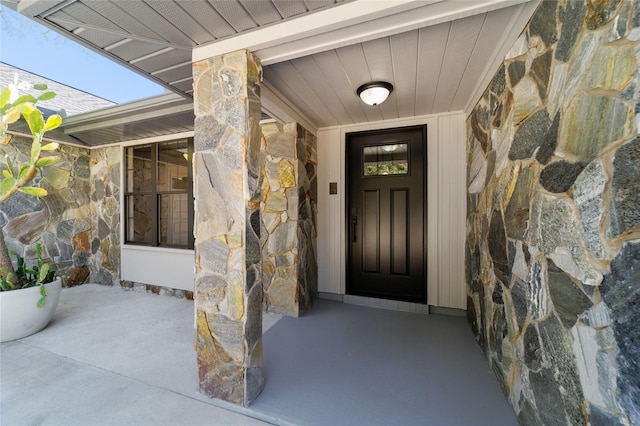 view of exterior entry with stone siding