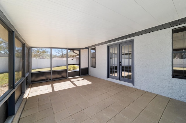 unfurnished sunroom featuring french doors