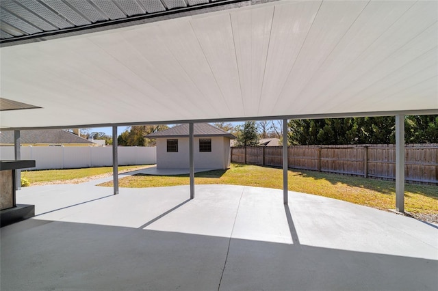 view of patio / terrace featuring an outbuilding and a fenced backyard