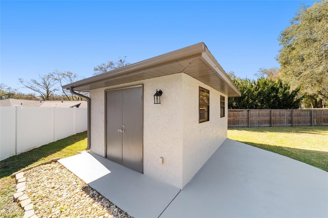 view of shed featuring a fenced backyard