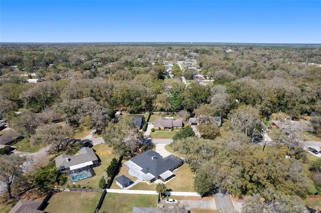 drone / aerial view featuring a forest view