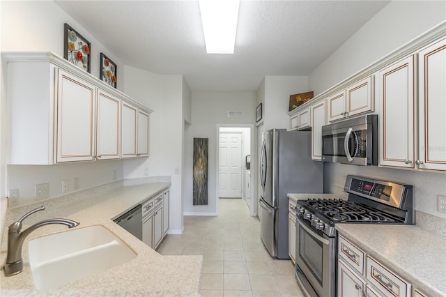 9458 SW 93rd Loop, Ocala, FL 34481 - kitchen featuring stainless steel appliances, light countertops, backsplash, light tile patterned flooring, and a textured ceiling