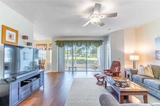 9458 SW 93rd Loop, Ocala, FL 34481 - living room with wood finished floors, healthy amount of natural light, ceiling fan, and a chandelier