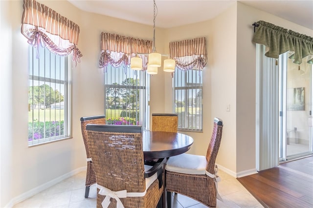 9458 SW 93rd Loop, Ocala, FL 34481 - dining room with a chandelier and baseboards